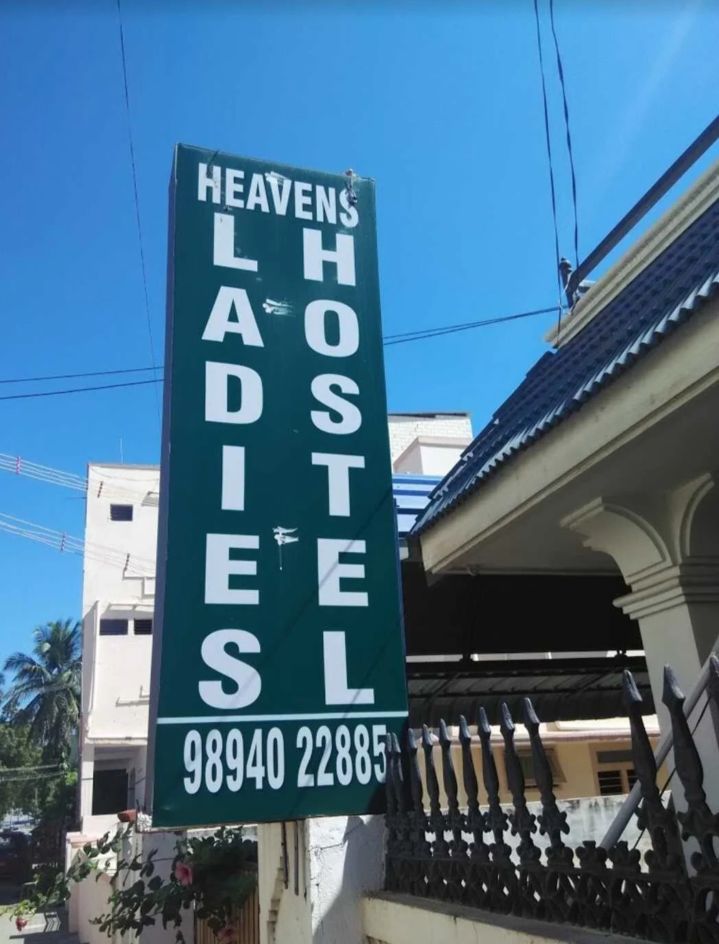 Heaven Ladies Hostel signboard near the entrance